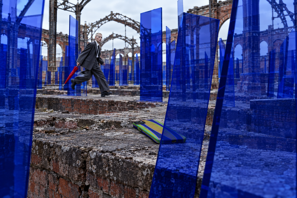 Cobalt glass intervention among the ruins of a London railway station