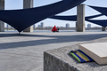 Graphic fabric intervention on a brutalist Thamesmead plaza