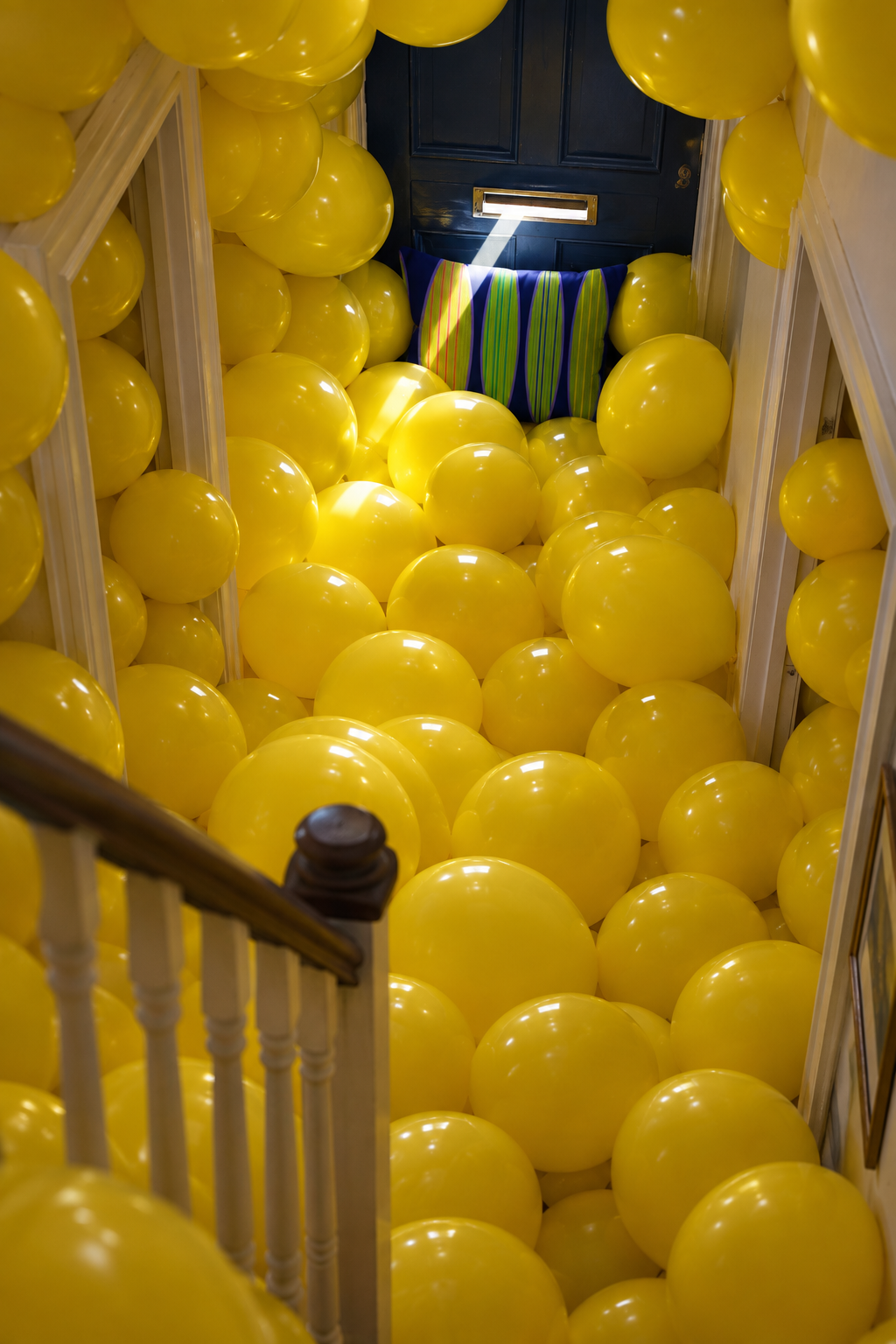 Navy Watermelon, balloon-filled terraced hallway